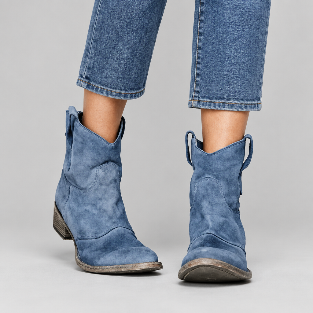 Woman wearing the Piper comfortable western pull-on ankle boots with jeans