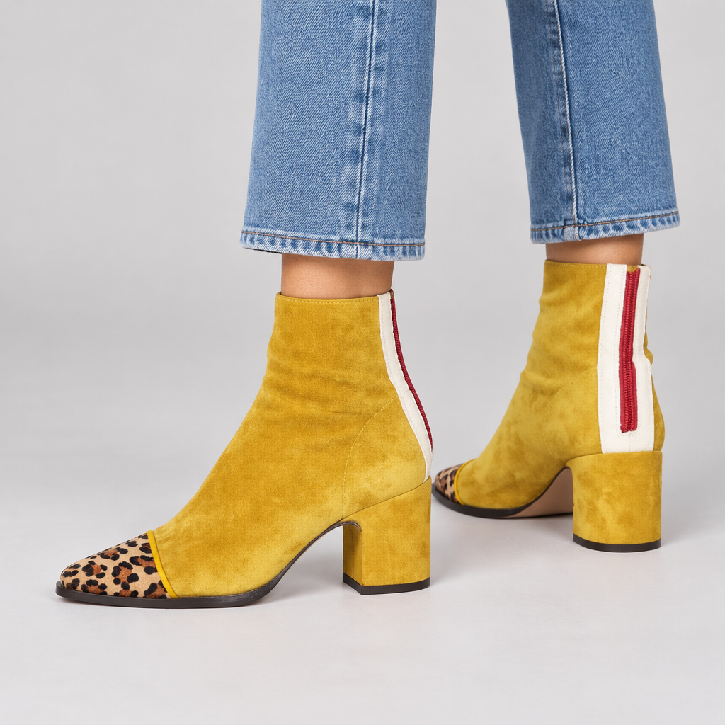Woman wearing the Mia leopard-toe block heel ankle boots with jeans